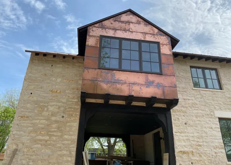 Copper metal panel facade on a stone building for Metal Roof Coating in Lenoir City