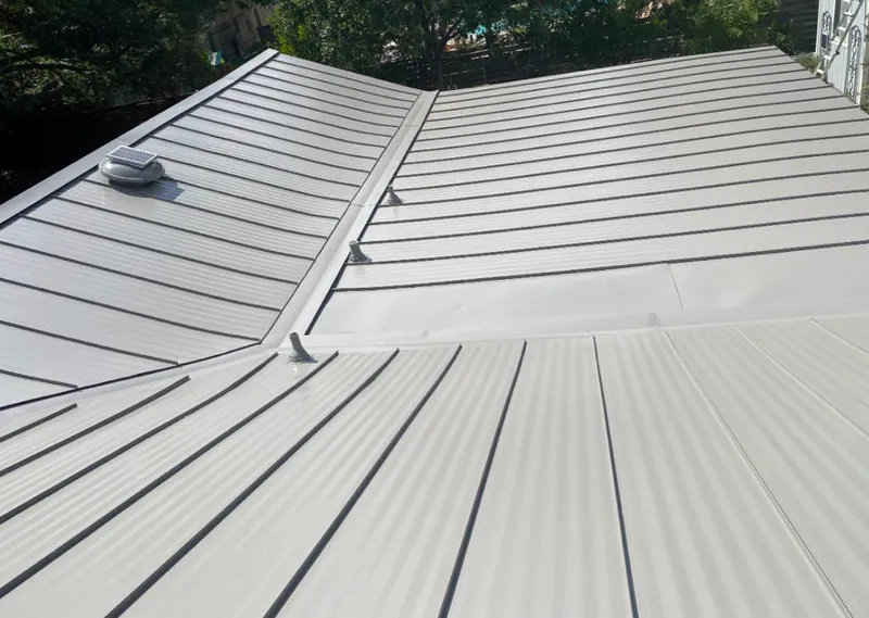 Solar attic fan installed on a metal roof for Roof Ventilation in Lenoir City